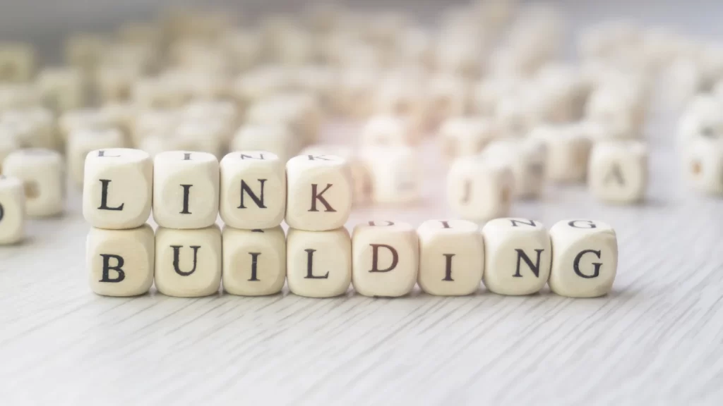 Wooden blocks spelling out 'Link Building' on a table